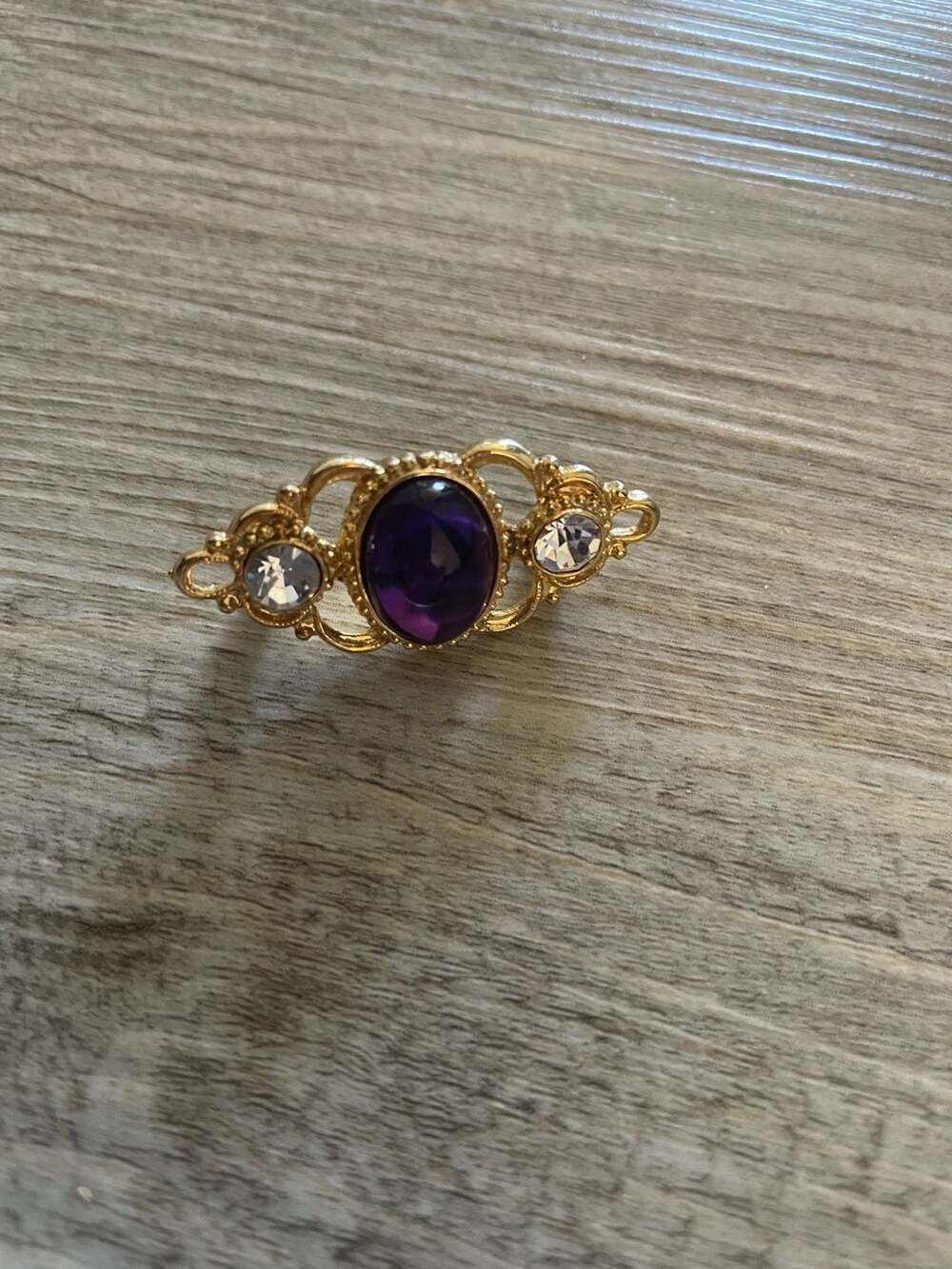 Vintage Gold Tone Ornate Brooch with Purple Cabochon and Clear Rhinestones